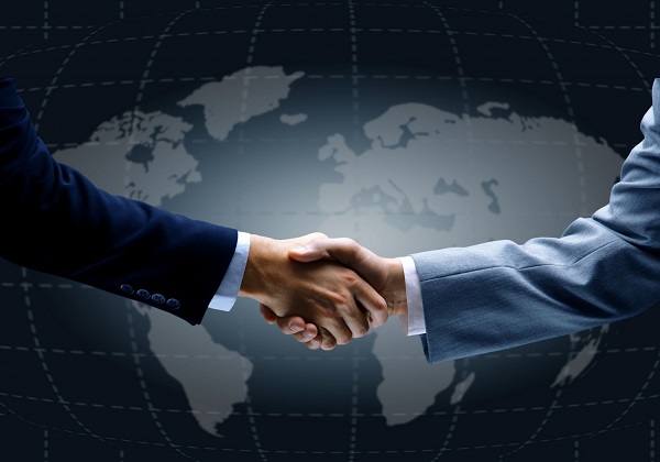 Handshake in Front of World Map representing logistics
